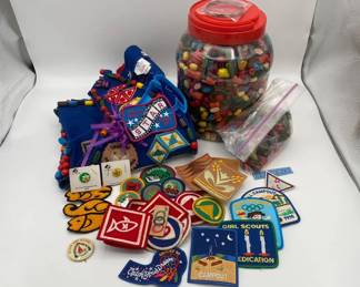 Collection of Campfire and Brownie Scout Paraphernalia with Wood Beads Patches and Vest