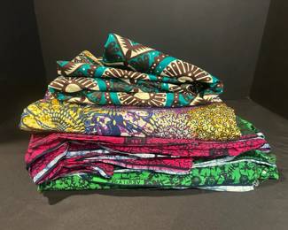 West African Wax Print Fabric In Purple Pink And Green Hues Some Uncut