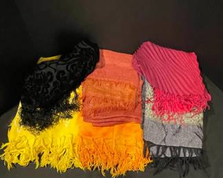 Assortment Of Fringed Scarves In Different Sizes Materials