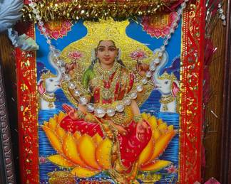 Lakshmi seated on lotus with elephants