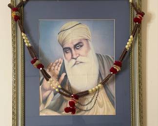 Framed Portrait of Guru Nanak Dev Ji with Decorative Garland