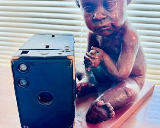 cherub and vintage camera