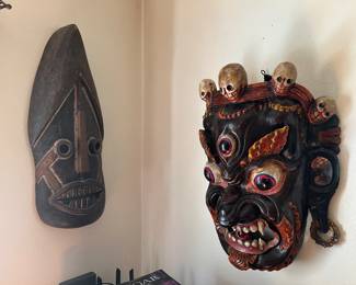 2 African hand carved mask .The one on the right is Mahakala:the Multifaceted Protector Deity in Art and Ritual/celebrated in both Buddhism and Hinduism