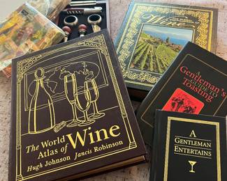 Books and objects relating to wine....he has a large collection of wine glasses