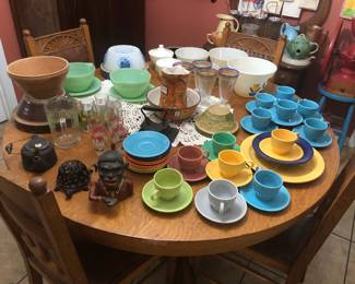 White Fire King Tuple Bowls Grease Jars, Antique Stoneware Bowls, Fiesta Ware, Monkey Coin Bank. Turtle Cast Iron String Holder, Antique Cast Iron Flutter More! Oak Table With 4 Matching Chairs.