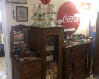 Vintage Coca Cola Fishtail Clock, Mall & Large Red Coca Cola Round Metal Button, Wooden Gent Dress Full of Books, Wooden Chest of Drawer with Straight Razors, Tobacco Cans & Other 