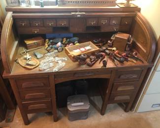 Rolltop Desk, Smoking Pipes And Stand, Cigars, Vintage Clear Candy Containers & Several Rolling Metal Rabbit Pulling Egg.