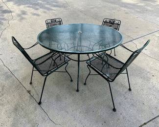 Green iron patio table and 4 armchairs