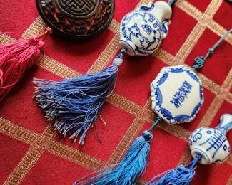 On the Left...Cinnabar Oriental Piece! All of rest are Porcelain. These alll are Chinese Good luck pieces.