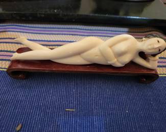 Vintage Reclining carving on stand.
