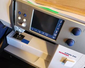 Bernina Sewing Machine with Accessories and Cabinet.