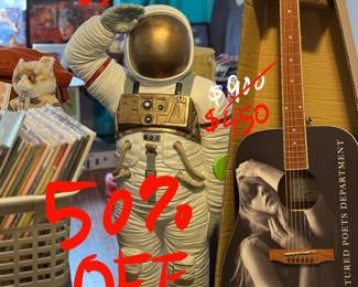 50% off astronaut statue & Taylor Swift Tortured Ports Department Guitar