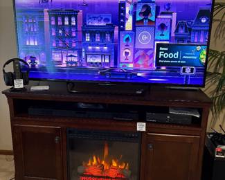 Sony 64” TV and fireplace console
