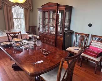 Universal dining room table with 2 leaves, 6 chairs, china cabinet, and buffet