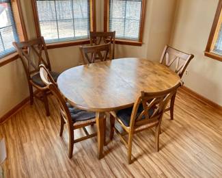 Hardwood dining room table with chairs