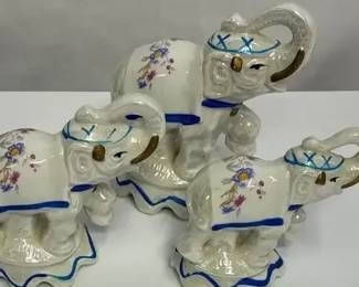 Three handpainted porcelain elephant figurines