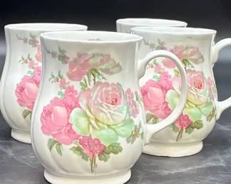 Vintage Rosewood China fine bone China mug with a pink rose pattern, made in Staffordshire, England.