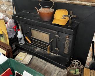Cast iron fireplace insert. Must be uninstalled still