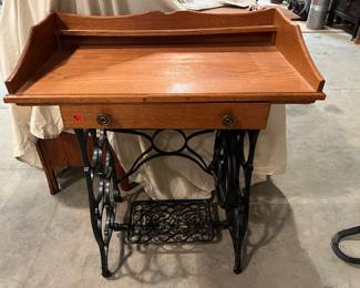 F 4.	 Small Desk w/Pedal Sewing Machine Base				29” x 16” x 34”