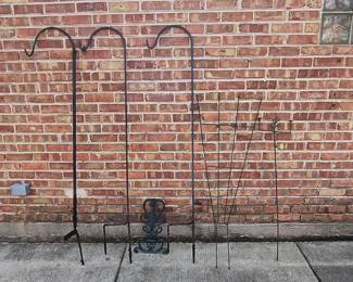 A selection of wrought iron hanging basket hooks and wrought iron garden trellises