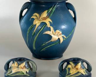 A Roseville Pottery Zephyr Lily Bermuda Blue cookie jar with lid, and matching pair of candlesticks; vintage 1940s/1950s.