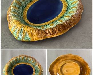 A circa 1880-90 hand-painted majolica oval bread tray, 11” x 13”,  w/turned down lip w/raised transcription along border 'Eat Thy Bread With Thankfulness', pattern of raised wheat stalk on green ground, center of large oval w/cobalt blue.