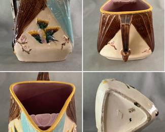 A charming antique majolica large pitcher, 8-1/2" H, circa 1880, triangular form pitcher in bird and fan pattern of green, yellow, brown and pink, pink flowers on brown twigs, fans of brown and turquoise, crackle cream background and lavender liner. Raised English registration mark, likely by Banks & Thorley Pottery.