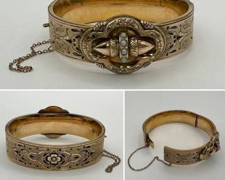 A charming Victorian rolled gold hinged belt buckle bangle bracelet, engraved and enameled with floral motif on textured ground, the buckle in quatrefoil form containing two sculptural acorns held with a band; has safety chain.