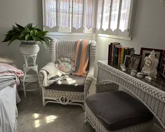 White wicker arm chair with cushion