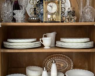 A set of depression era glass Monax Oxford pattern dishware by Macbeth-Evans Glass Company, a vintage Hamilton quartz carriage anniversary clock, pair of vintage Hollywood Regency style brass candle holders with ornate scroll work, cut glass vases and candle holders
