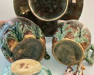 Reverse view of a majolica plate c. 1880, turquoise basket weave and pink floral pattern by Joseph Holdcroft, Sutherland Pottery; an American majolica waste bowl c. 1880-90 w/turquoise rope/basketweave pattern ground w/raised wild rose pattern; a pair of 1880 antique majolica pitchers in shell/seaweed pattern by American potter Griffin, Hill & Smith, shades of pink, green, brown w/lavender liner, impressed double circle trademark Etruscan Majolica GHS, 4-1/4" H and 4-3/4" H; rare pair of majolica miniatures, gentleman and lady dressed as 18th century French nobility, incised numerals on base.
