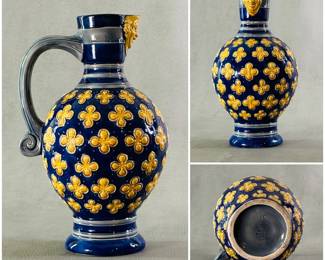 An English majolica pitcher by Minton circa 1871, moulded ovoid body in a cobalt blue ground and raised deep yellow quatrefoil florets, loop handle rising to a masked spout; incised Minton mark, incised style #596, incised #12, incised date code (NC). 