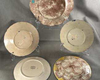 Reverse view of the selection of vintage and antique majolica plates 