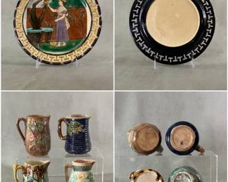 An antique Wedgwood "April" majolica dessert plate, part of a "Months of the Year" series designed by Helen J. A. Miles, pierced border w/yellow key fret design, pink and purple rim,  center well of outlined transfer print of young lady picking apples, hand painted and the month of September indicated at bottom center. Wedgwood mark, circa 1870s. Shown with 4 antique majolica ware cream pitchers or creamers, decorated with roses, flowering fruit vines, on ribbed or basket weave pattern ground; branch form handles; one with impressed Griffin, Hill & Smith mark of Phoenixville, PA.