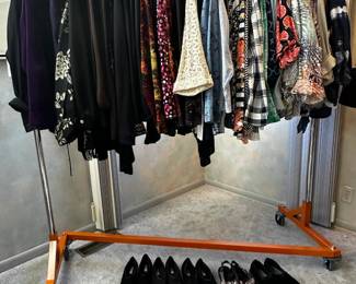 Women's plus size clothing and a variety of shoes, sandals, sneakers – mostly casual, and most size 10 or close to.