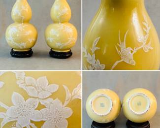 More views of the large pair of Chinese double gourd vases in yellow glaze with raised white applied design of birds in flowering branches, resting on carved wooden stands