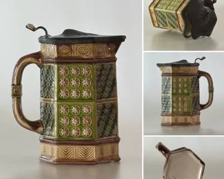 Antique Wedgwood majolica six-sided pitcher known as the Tunbridge Jug or tankard, 7-1/4" H, with alternating panels of scalloped tiles in hunter/olive green, and pink flowers in lime green circles and background, tan bands top and bottom with incised patterns, brown edging and handle, 7-1/4", impressed Wedgwood mark, potter’s mark M, year mark P for 1887; pewter lip impressed stamped Thompson-Broadhead PA, Sheffield, England. 