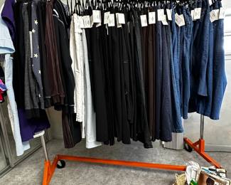 A selection of plus size women's jeans, casual trousers, and more
