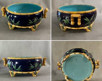 A large antique Minton majolica bowl, 11-3/4" diameter x 5" H, impressed Minton #1772, circa 1870 Stoke on Trent, England. Footed bamboo design bowl in richly painted colors; edging, hand grips/base feet all in gold brown bamboo design, sides of cobalt blue with raised branch and green leaves, turquoise liner.