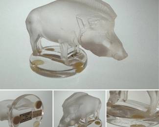 A signed Lalique "Sanglier" (Wild Boar) crystal figurine, originally designed by René Lalique in 1929 as a car radiator mascot. The body in frosted crystal rests atop a clear crystal glass base, and is signed Lalique France on the base.
