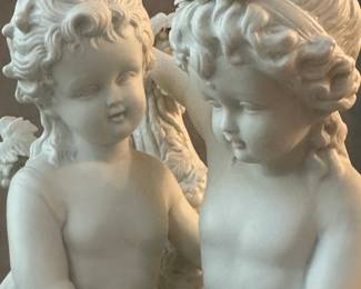 Closeup of the charming large bisque porcelain figural statue of two children at grape harvest - beautifully modeled!