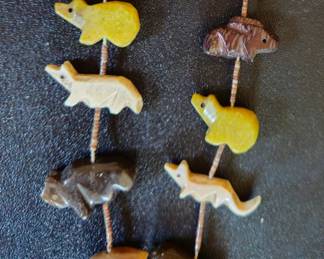 Very vintage needlepoint heshi necklace with green, brown, tan, olive green fetishes. The green ones show as yellow in the photo.