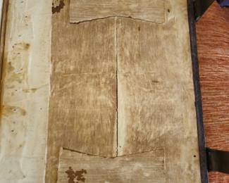 Cover of the book is made of wood with butterfly dovetailing