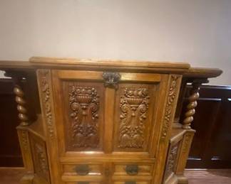 Antique Jacobian-Style Oak Cabinet or Sideboard, Ornate C;a;rvings, SPanish Revival, Hand-Carved Panels, Spiral Columns, Carved Claw Feed, 1920's. Serves as a Sideboard, Buffet or Liquor Cabinet, 52"w x 18"D x 40"H