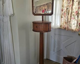 Antique oak shaving stand with adjustable mirror and drawer.