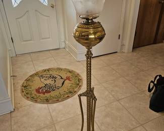 Antique brass Victorian oil floor lamp with frosted glass shade.