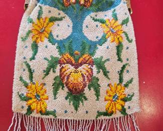 Vintage floral beaded reticule purse with metal frame and fringe.