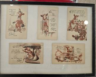Framed collection of Elsie the Cow postcards from the New York World's Fair.