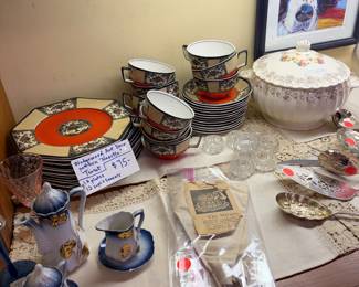 Numerous tea sets.  