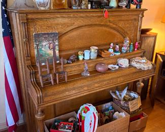Vintage upright piano.  Knickknacks.  Christmas.